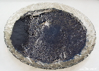 dry woad pigment on plate | woad.org.uk